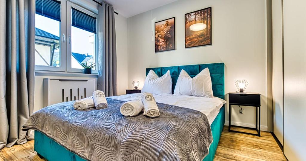 Posteľ alebo postele v izbe v ubytovaní Apartamenty Marilu