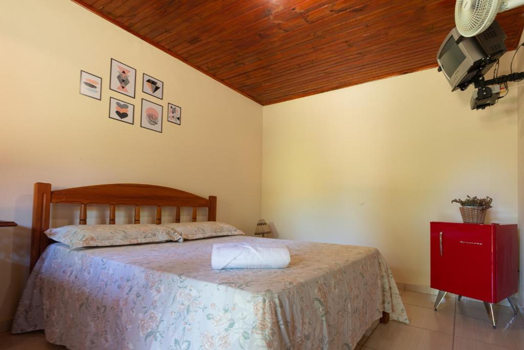 Cama ou camas em um quarto em Pousada Aconchego