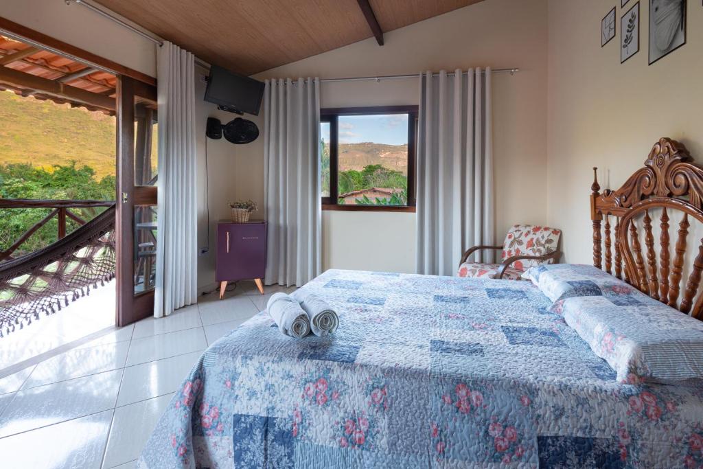 Cama ou camas em um quarto em Pousada Aconchego