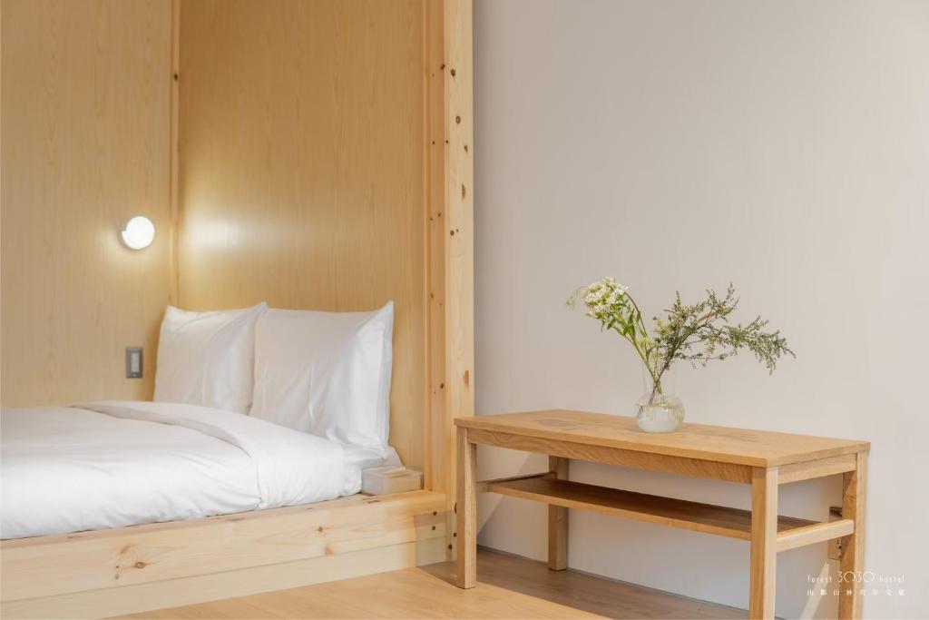 Postel nebo postele na pokoji v ubytování 山鄰山林青年文旅 forest 3030 hostel