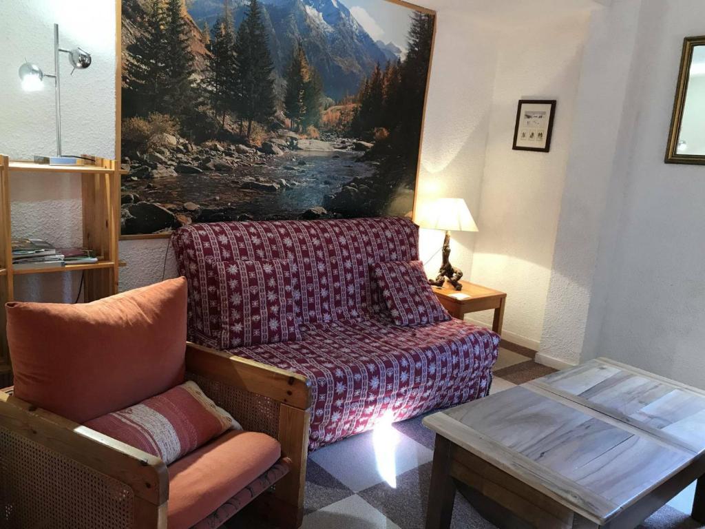a living room with a couch and a chair at Appartement Corrençon-en-Vercors, 3 pièces, 6 personnes - FR-1-515-7 in Corrençon-en-Vercors