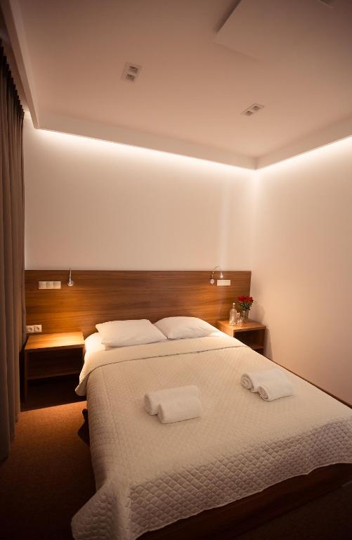 Postel nebo postele na pokoji v ubytování Hotel Rubin