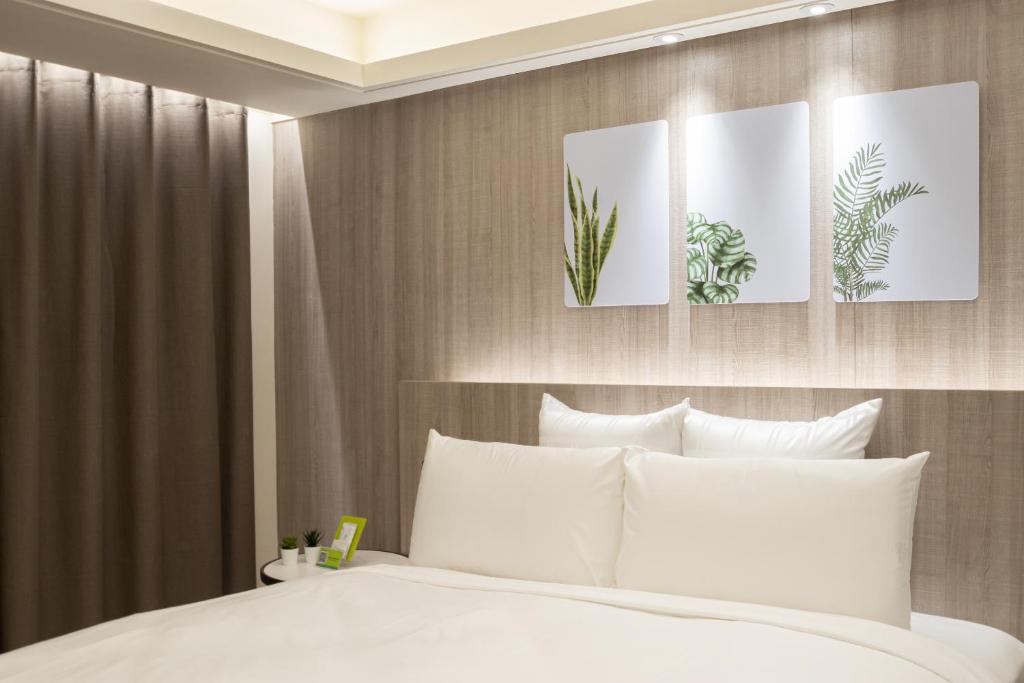 Postel nebo postele na pokoji v ubytování 168 Motel-Zhongli