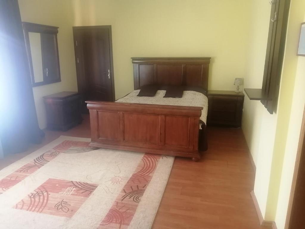 Postel nebo postele na pokoji v ubytování Pensiunea Casa Benko