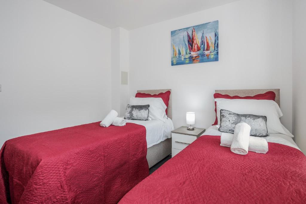 En eller flere senge i et værelse på CONEN Image Two Apartment