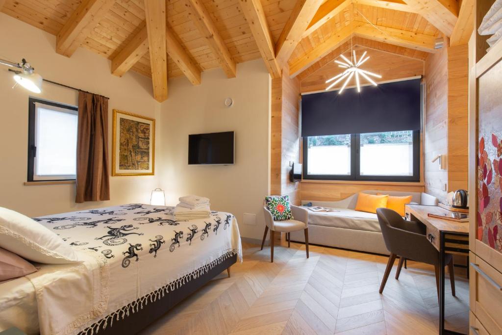 Postel nebo postele na pokoji v ubytování d'ARTEmisia Chambres d'hôtes