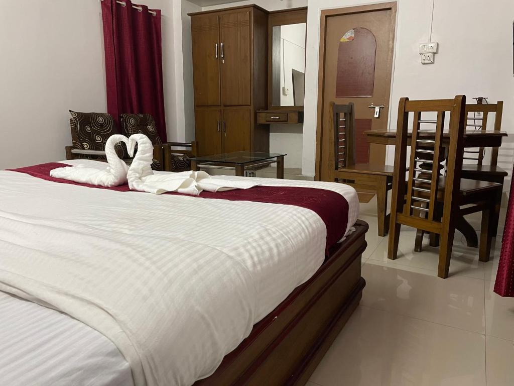 Postel nebo postele na pokoji v ubytování Hotel Caveri