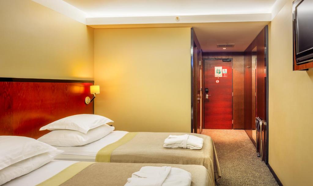 Postel nebo postele na pokoji v ubytování Meresuu Spa & Hotel