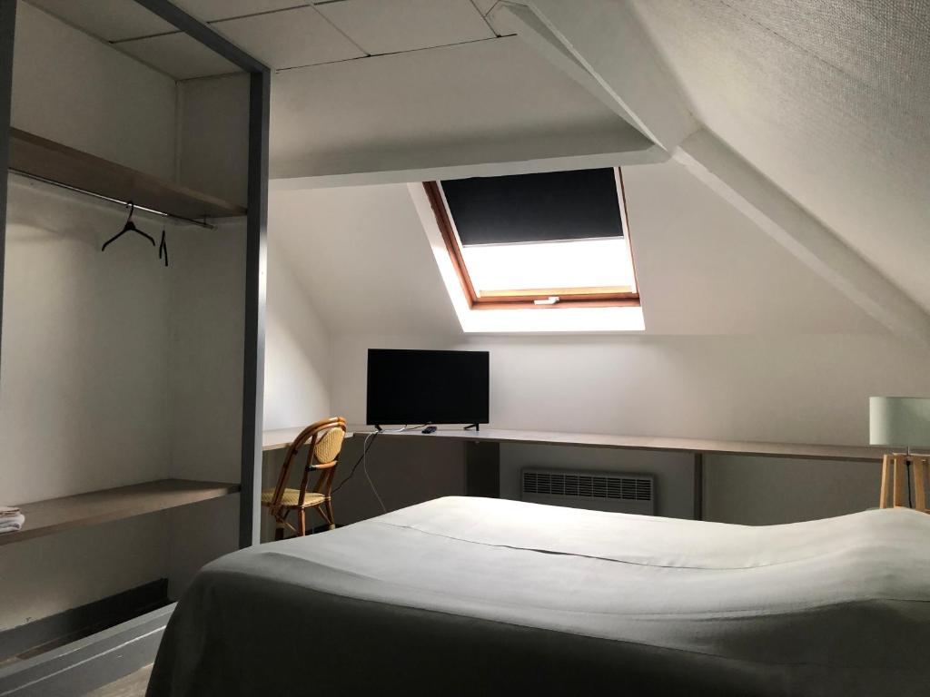 Postel nebo postele na pokoji v ubytování Hôtel Restaurant De La Mare