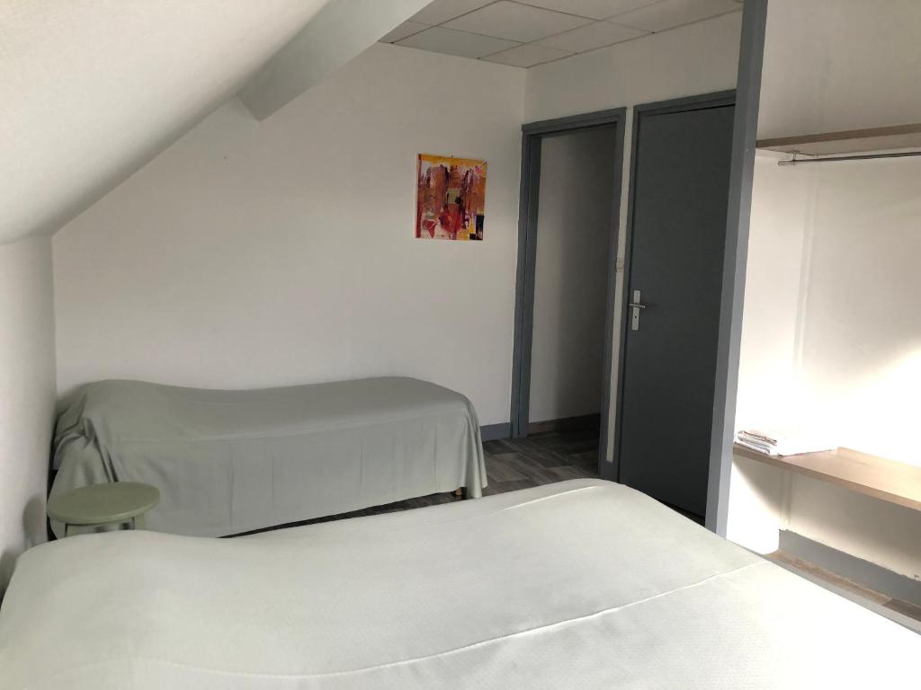 Postel nebo postele na pokoji v ubytování Hôtel Restaurant De La Mare