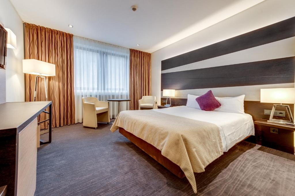 Postel nebo postele na pokoji v ubytování Parc Hotel Alvisse