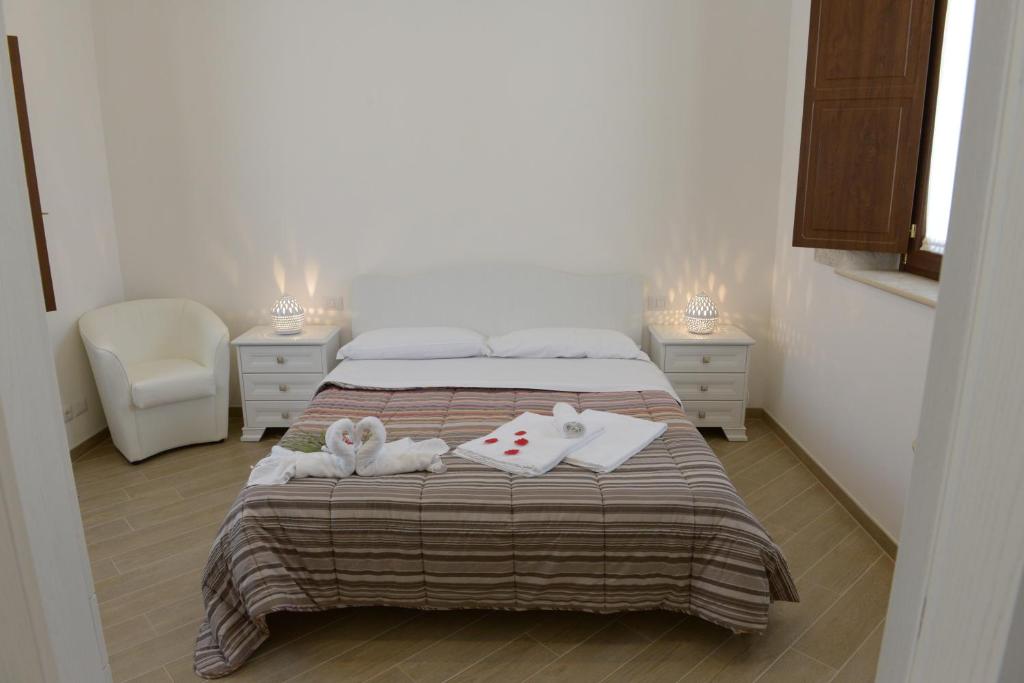 A bed or beds in a room at Domus Antiqua Residence