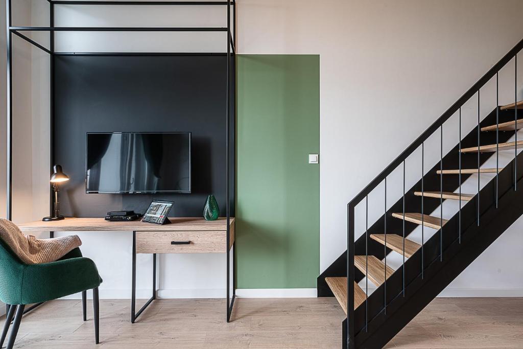 Televízia a/alebo spoločenská miestnosť v ubytovaní RentPlanet - Apartamenty Zarembowicza