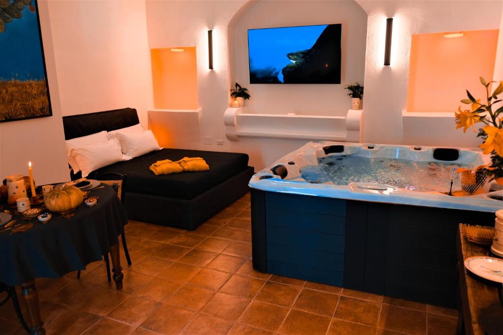 TV a/nebo společenská místnost v ubytování Alchimia Luxury Suites