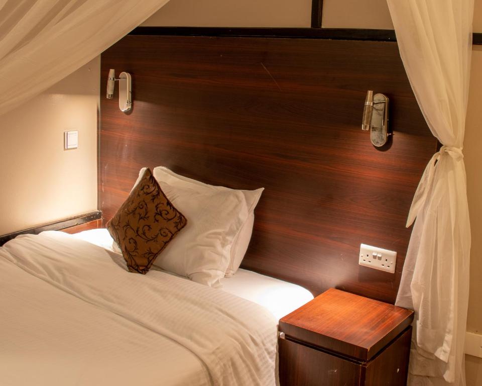 Postel nebo postele na pokoji v ubytování D2W Residency Suites