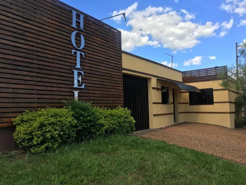 a building with a sign on the side of it at Hotel em SBO - São Francisco in Santa Bárbara dʼOeste