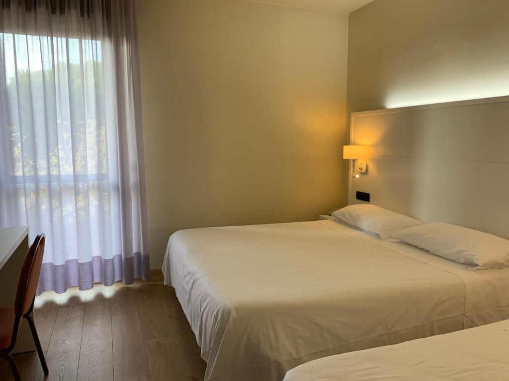 Postel nebo postele na pokoji v ubytování Hotel Parigi 2 & Spa