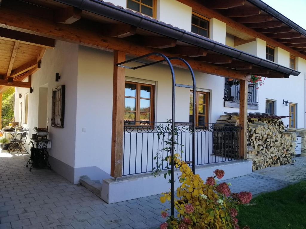 a house with a gate in front of it at Ferienwohnung Jahnel in Waging am See