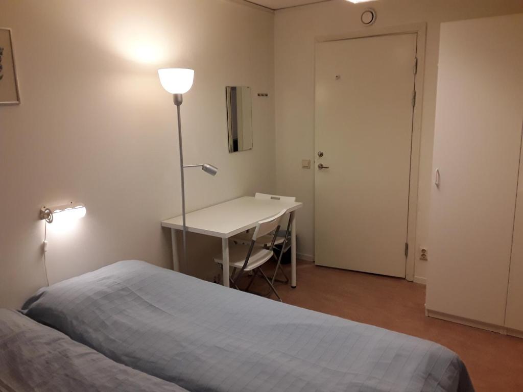Postel nebo postele na pokoji v ubytování Knihsgården