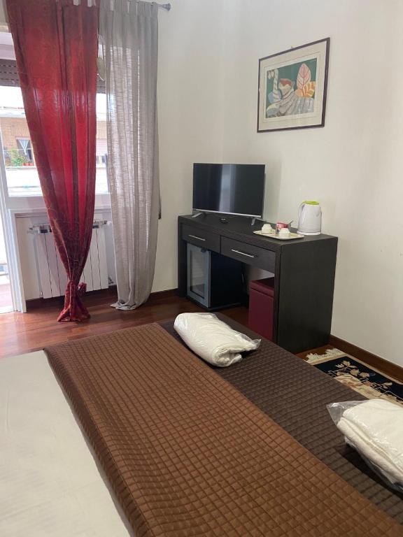 Telewizja i/lub zestaw kina domowego w obiekcie Bed and Breakfast Impruneta28