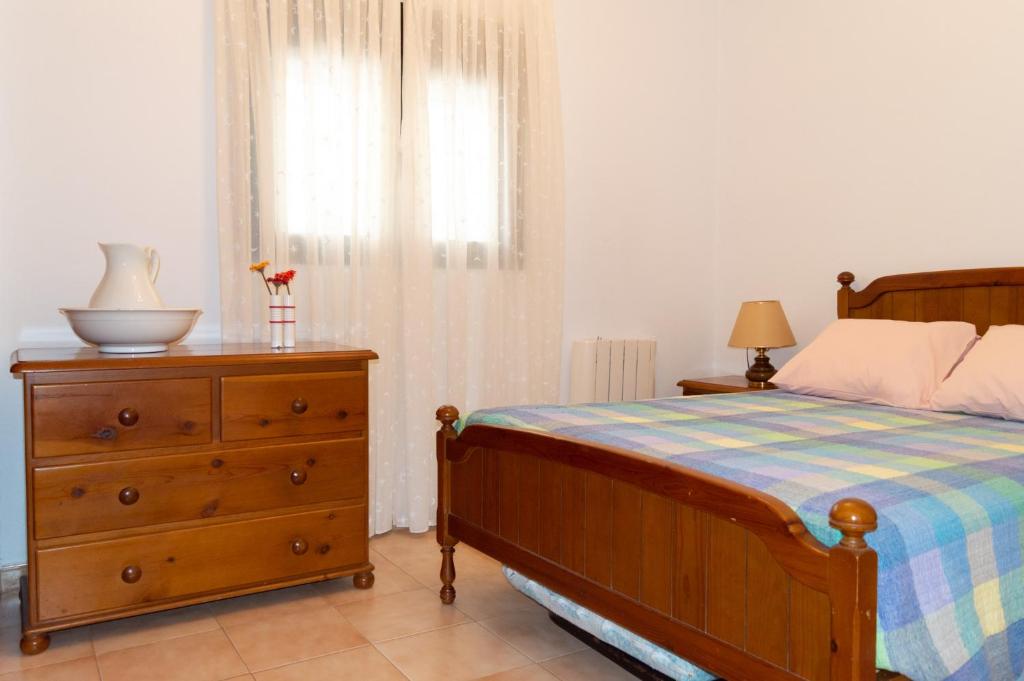 Łóżko lub łóżka w pokoju w obiekcie Casa Rural La Gallega