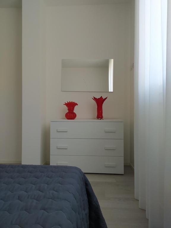 Postel nebo postele na pokoji v ubytování Jesolo Appartamenti F2 - Coral Red