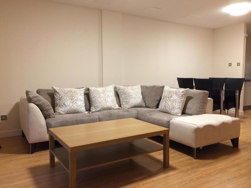 a living room with a couch and a coffee table at ochiltree apartment in Glasgow