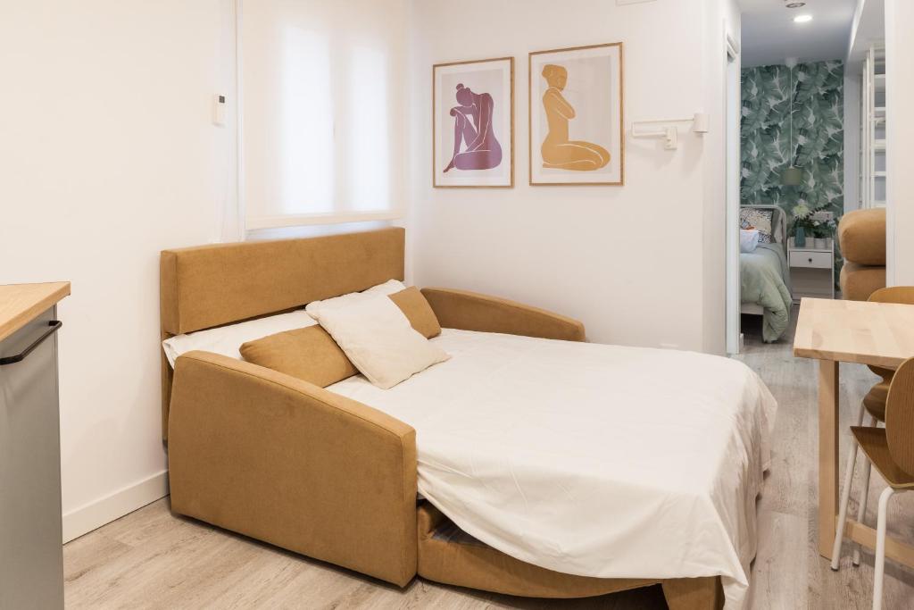 Postel nebo postele na pokoji v ubytování Madrid Comfort Suites