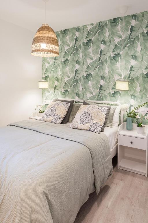 Postel nebo postele na pokoji v ubytování Madrid Comfort Suites