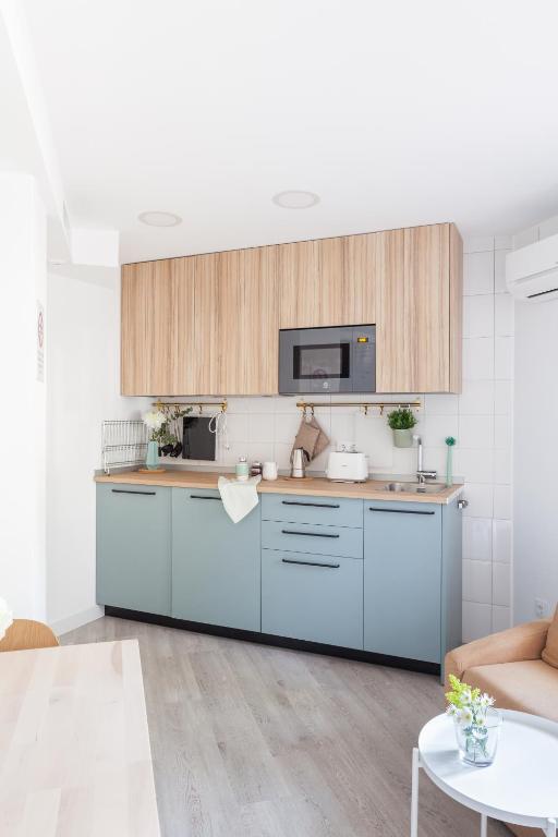 Kuchyň nebo kuchyňský kout v ubytování Madrid Comfort Suites