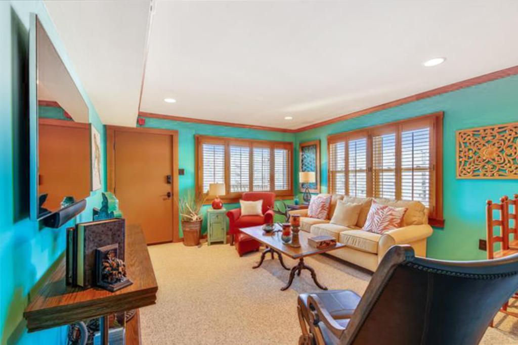 a living room with a couch and a tv at Sea Lofts in Ocean City