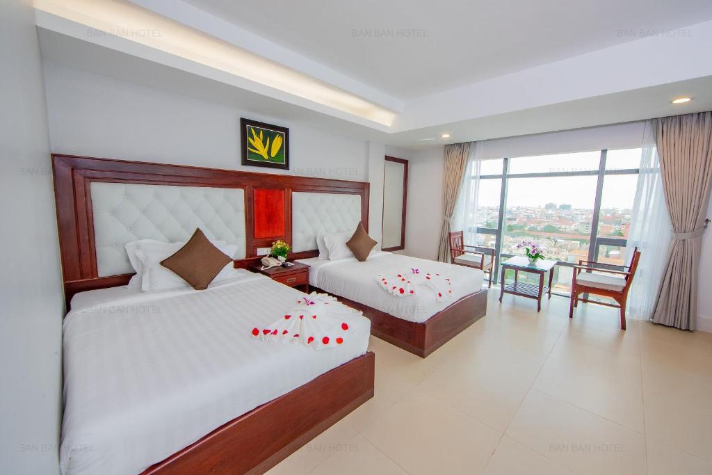 Postel nebo postele na pokoji v ubytování Ban Ban Hotel
