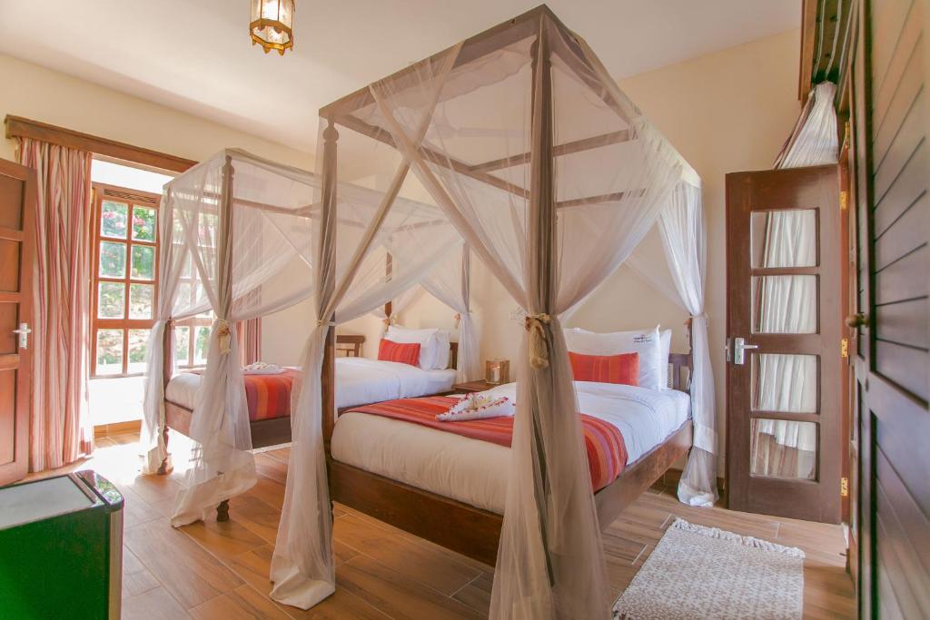 Postel nebo postele na pokoji v ubytování Mzima Beach Residences - Diani Beach