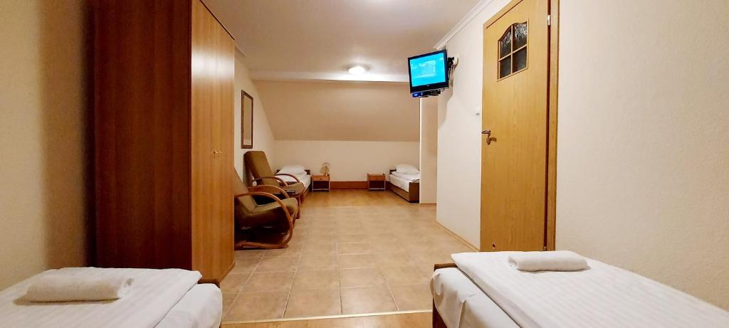 Posteľ alebo postele v izbe v ubytovaní Motel Panorama