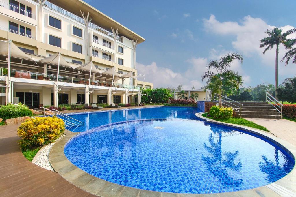 a large swimming pool in front of a building at The Royale Krakatau in Cilegon