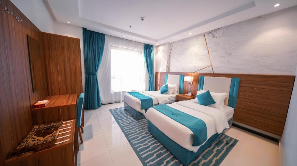 Cama o camas de una habitación en Manazil Al Dhayf