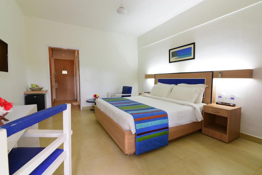 Postel nebo postele na pokoji v ubytování Peerless Resort Sri Vijaya Puram