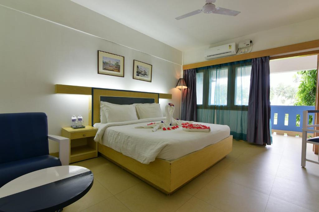 Postel nebo postele na pokoji v ubytování Peerless Resort Sri Vijaya Puram