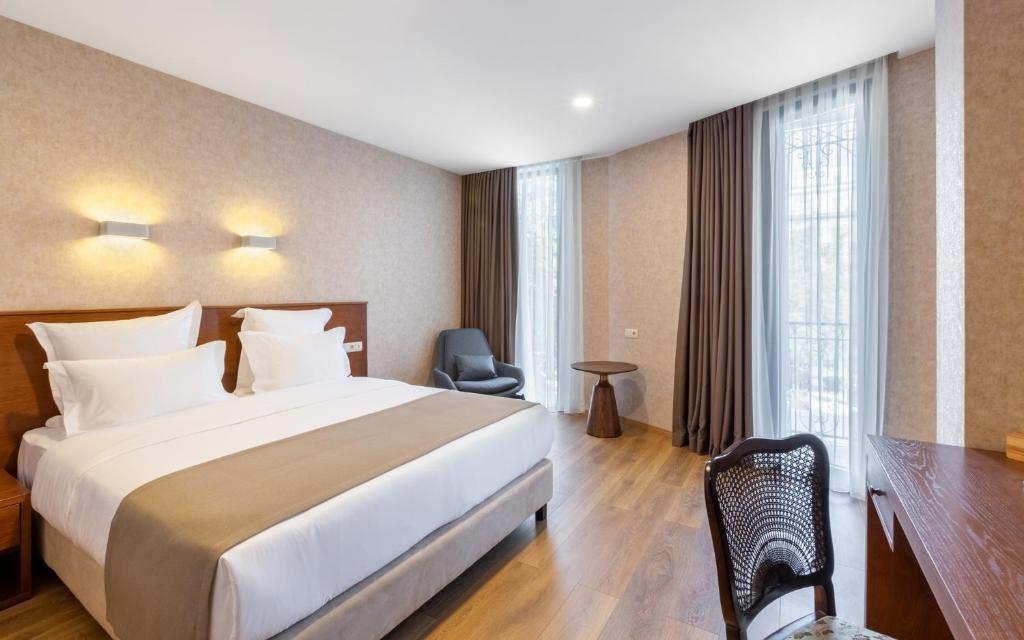 Postel nebo postele na pokoji v ubytování Mukhrantubani Boutique Hotel