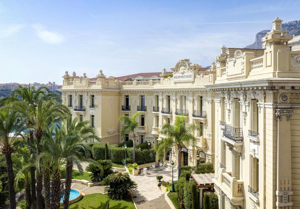 a large building with a view of a city at Hôtel Hermitage Monte-Carlo in Monte Carlo