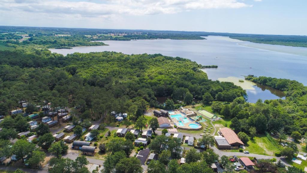 an aerial view of a resort next to a lake at CAMPING AZU'RIVAGE in Azur