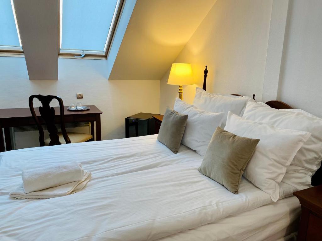 Posteľ alebo postele v izbe v ubytovaní OPERA16 Guestrooms