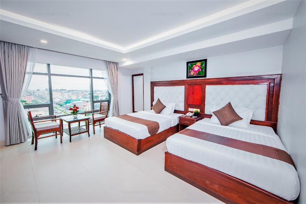 Postel nebo postele na pokoji v ubytování Ban Ban Hotel