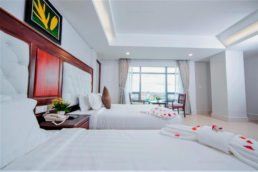 Postel nebo postele na pokoji v ubytování Ban Ban Hotel
