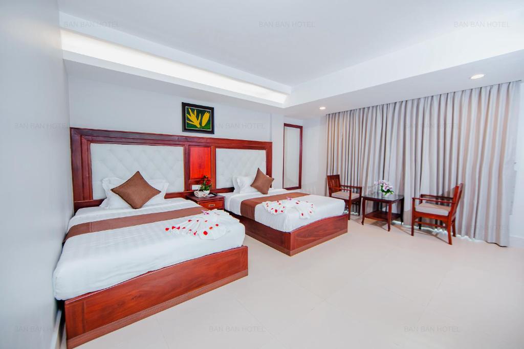 Postel nebo postele na pokoji v ubytování Ban Ban Hotel