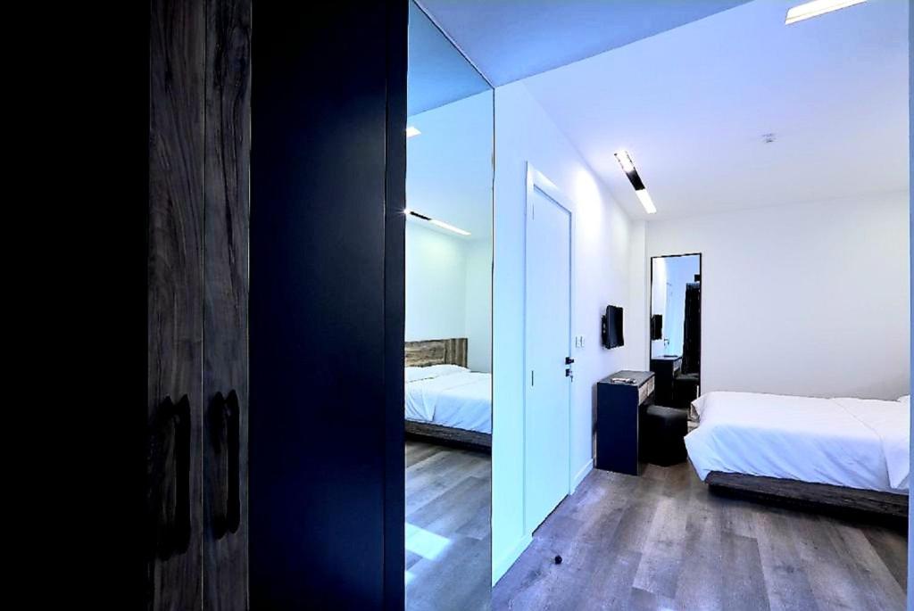 Postel nebo postele na pokoji v ubytování Loft 29 Residence