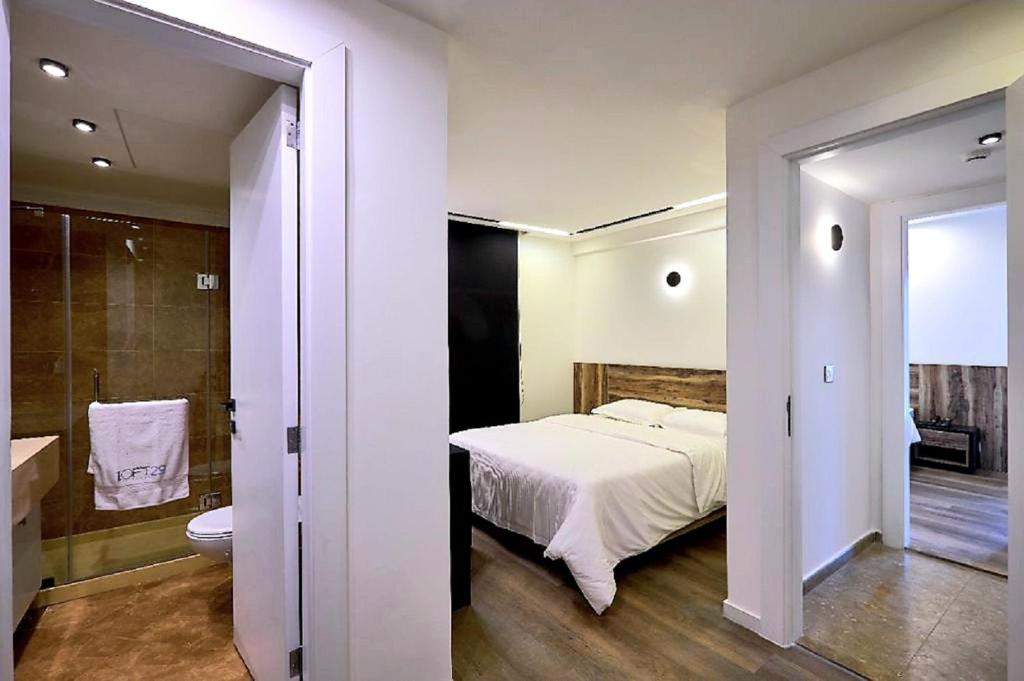 Postel nebo postele na pokoji v ubytování Loft 29 Residence