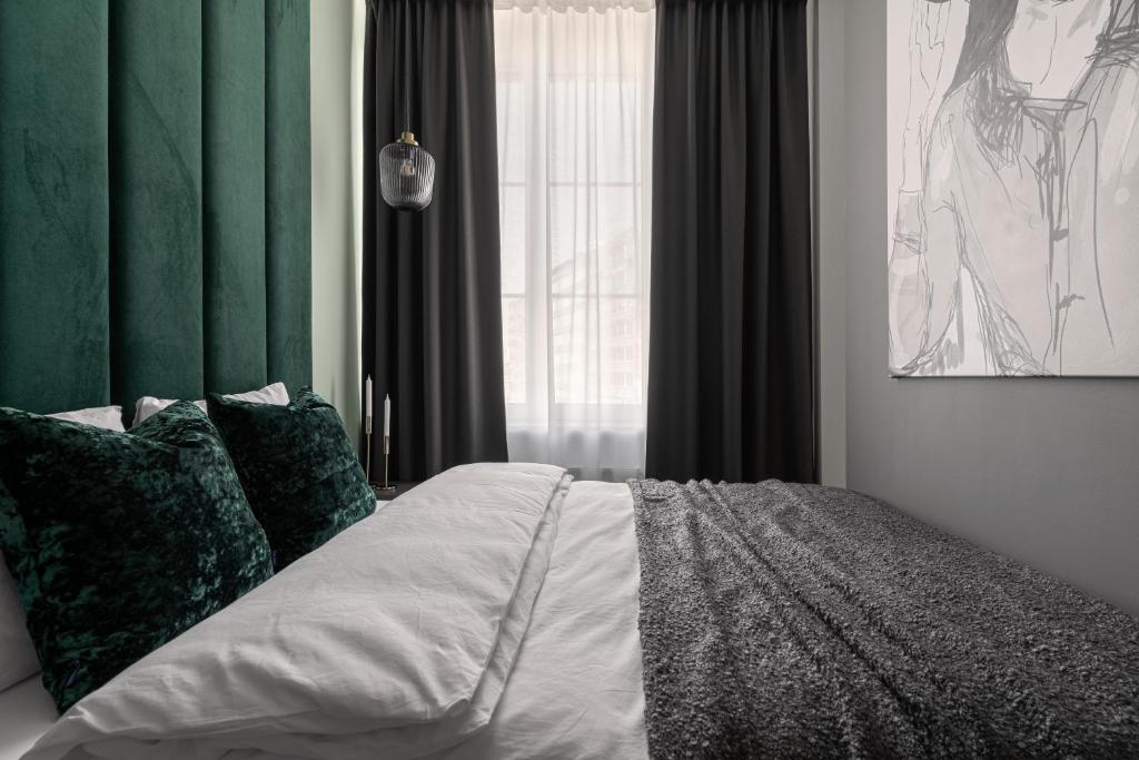 Posteľ alebo postele v izbe v ubytovaní APARTIO ROOMS Katowice