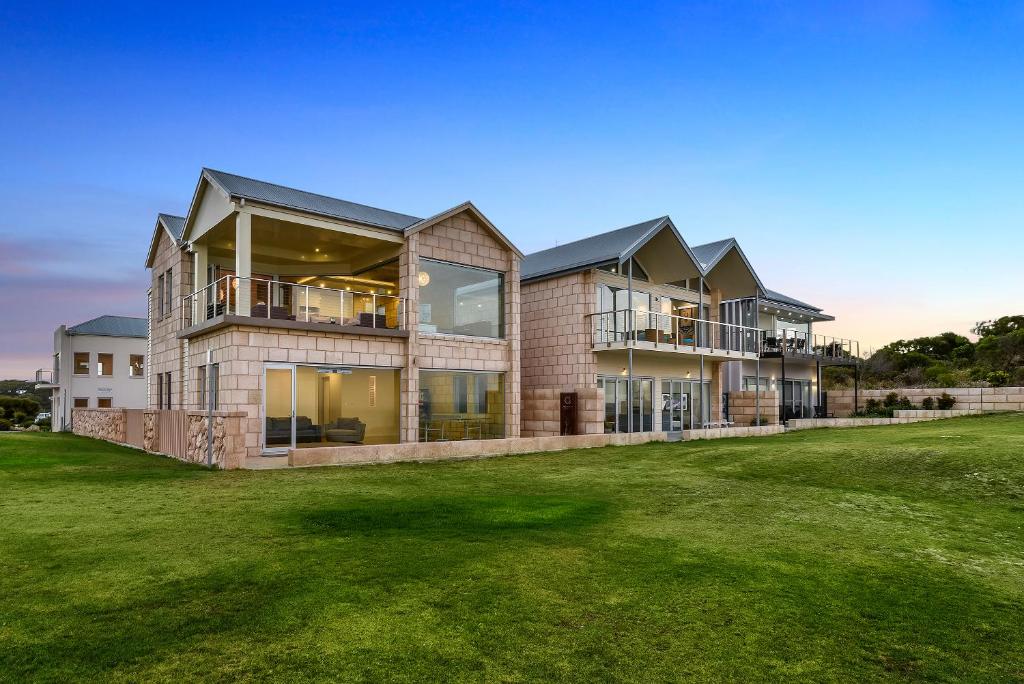 a large house with a lawn in front of it at Aloha Waterfront Properties in Robe