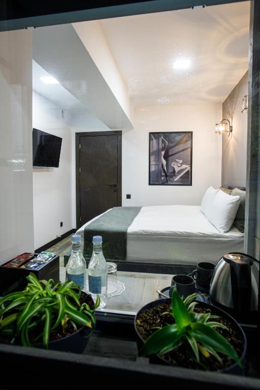 Postel nebo postele na pokoji v ubytování The Phoenix Boutique Hotel